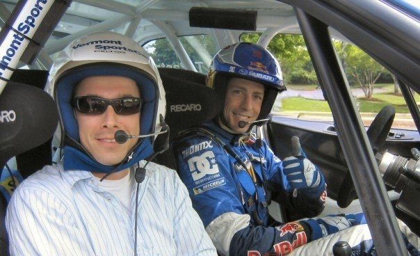 Will Yandell with Travis Pastrana in a rally car at a Red Bull event, mid-2000s